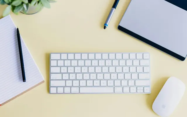 Designer desk with yellow stationery