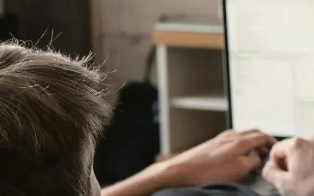 Person using a laptop at a desk