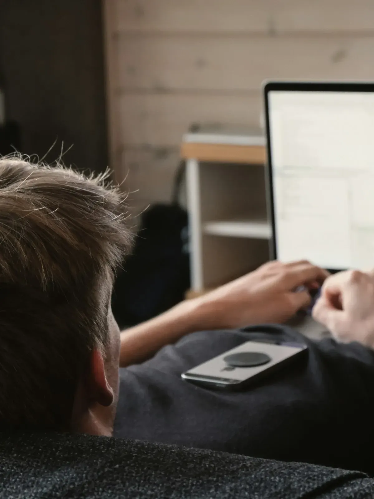 Person using a laptop at a desk